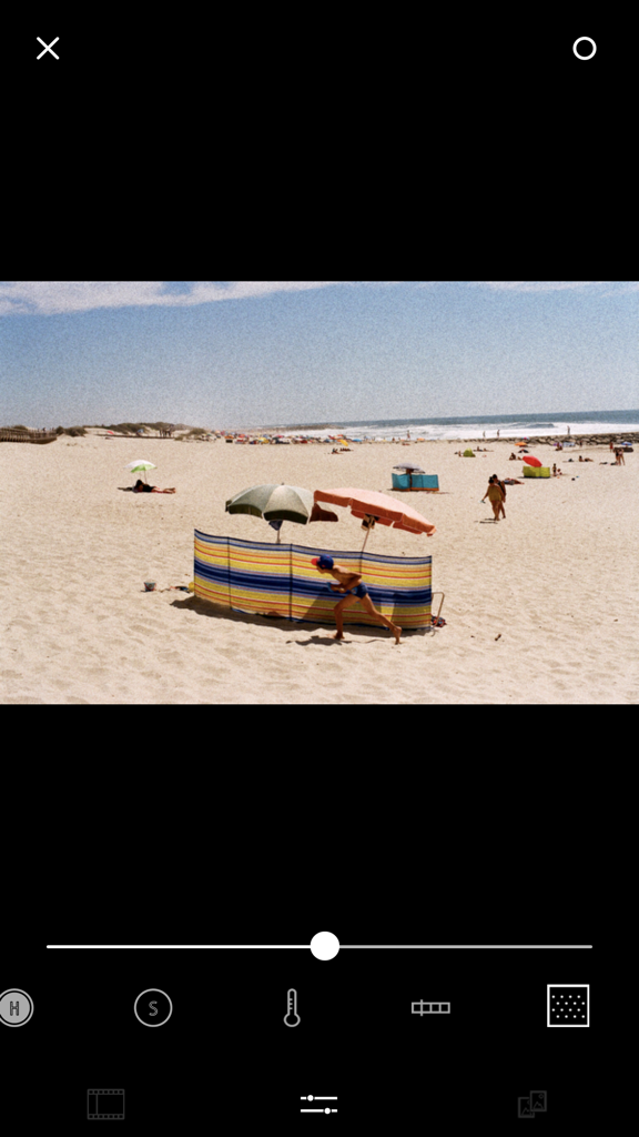 FILCA - Film Camera Filter - Beach photo with grainy film texture being edited in FILCA app