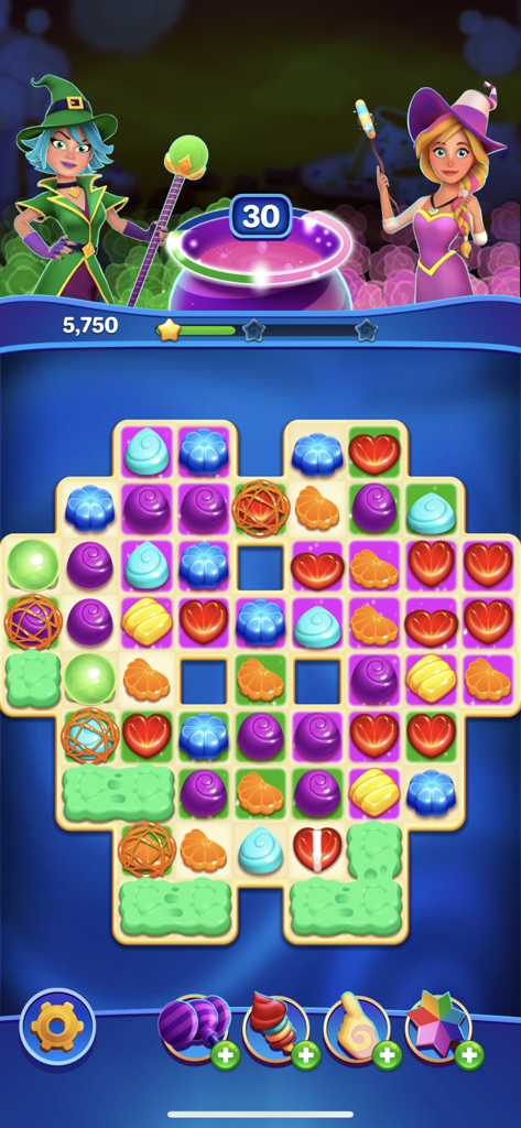 Crafty Candy - Gameplay screenshot of Crafty Candy showing a match 3 puzzle board with witch characters and a magic cauldron