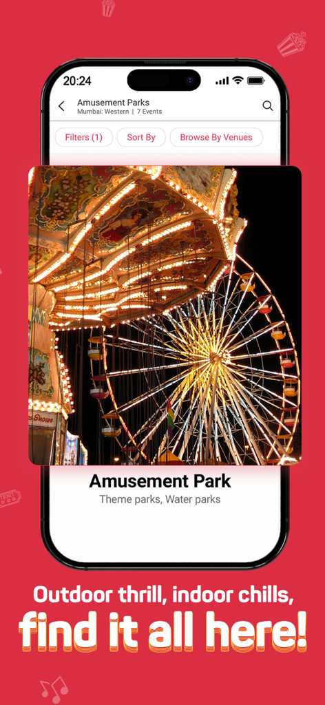 BookMyShow | Movies & Events - BookMyShow mobile app screen for booking tickets to amusement and theme parks featuring a lit up ferris wheel at night