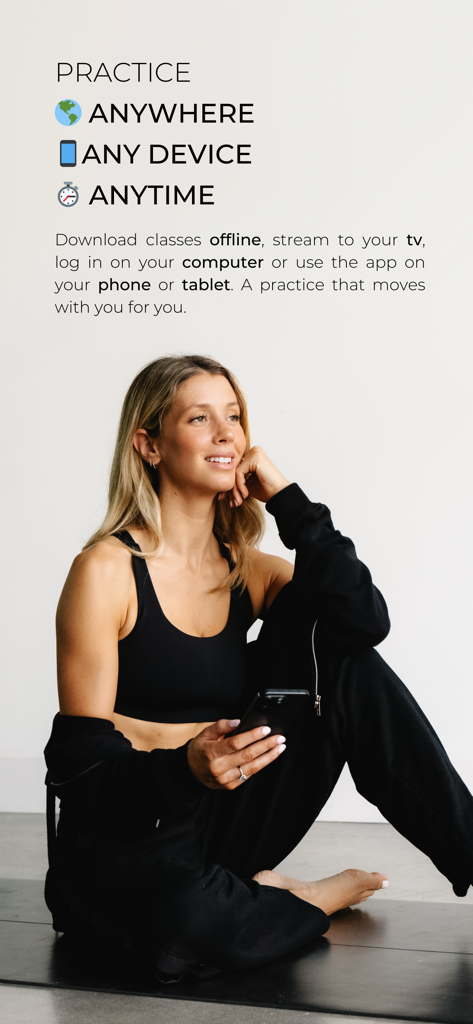 Blessed Yoga by Jen Morel - Jen Morel sitting on a yoga mat with a phone, illustrating that the Blessed Yoga app is accessible anywhere and on any device.