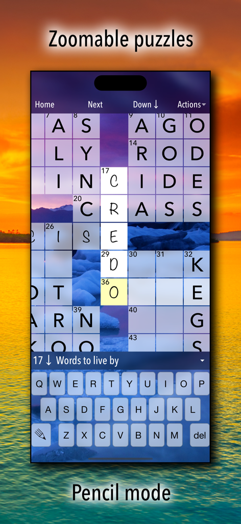 Crossword Puzzles! - Mobile gameplay of a crossword puzzle featuring zoomable grids and pencil mode over a scenic sunset background