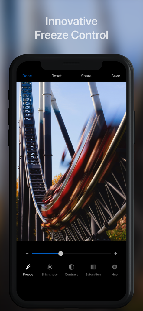 Slow Shutter Cam - Slow Shutter Cam app interface showing the Freeze Control tool being used to edit a motion blur photo of a roller coaster.