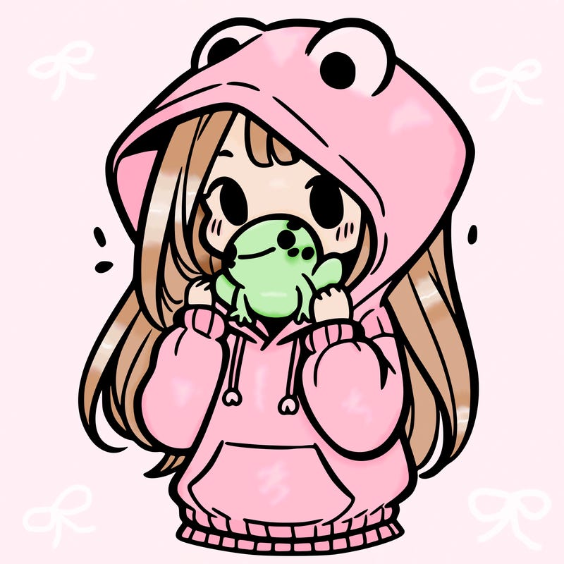 a girl holding a froggy hoodie
