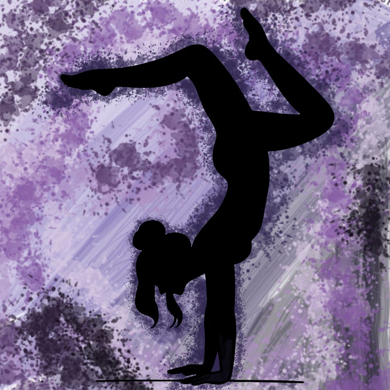 a woman doing a handstand