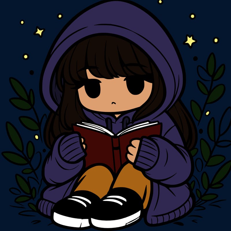 girl in oversized hoodie reading a book