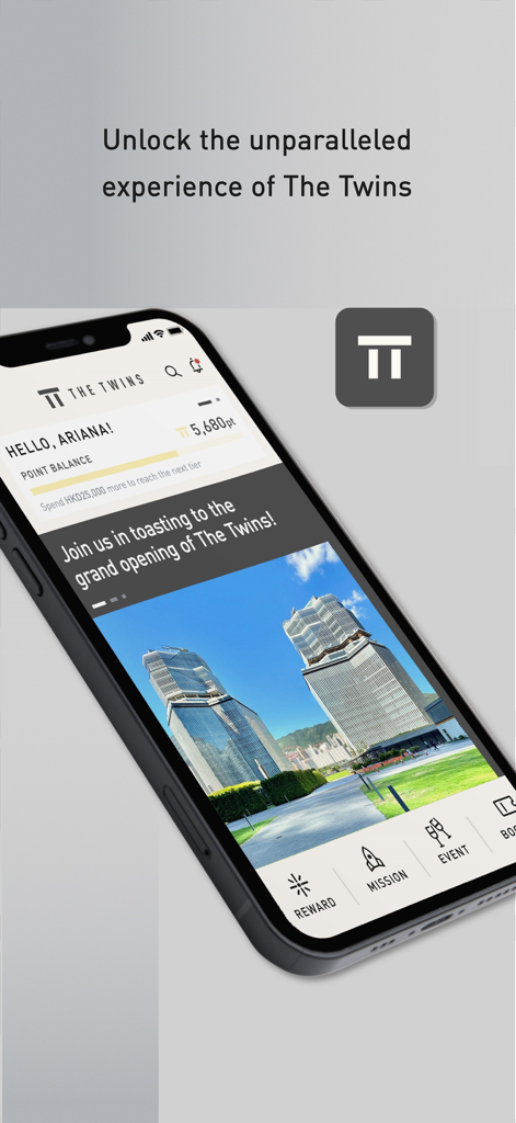 The Twins Rewards - Un smartphone que muestra la pantalla de inicio de la aplicación The Twins Rewards con el saldo de puntos del usuario y una vista de las torres gemelas