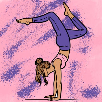 a woman doing a handstand
