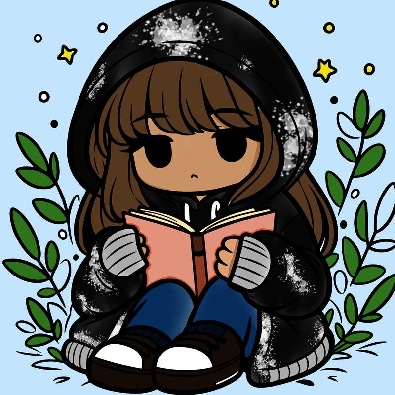 girl in oversized hoodie reading a book