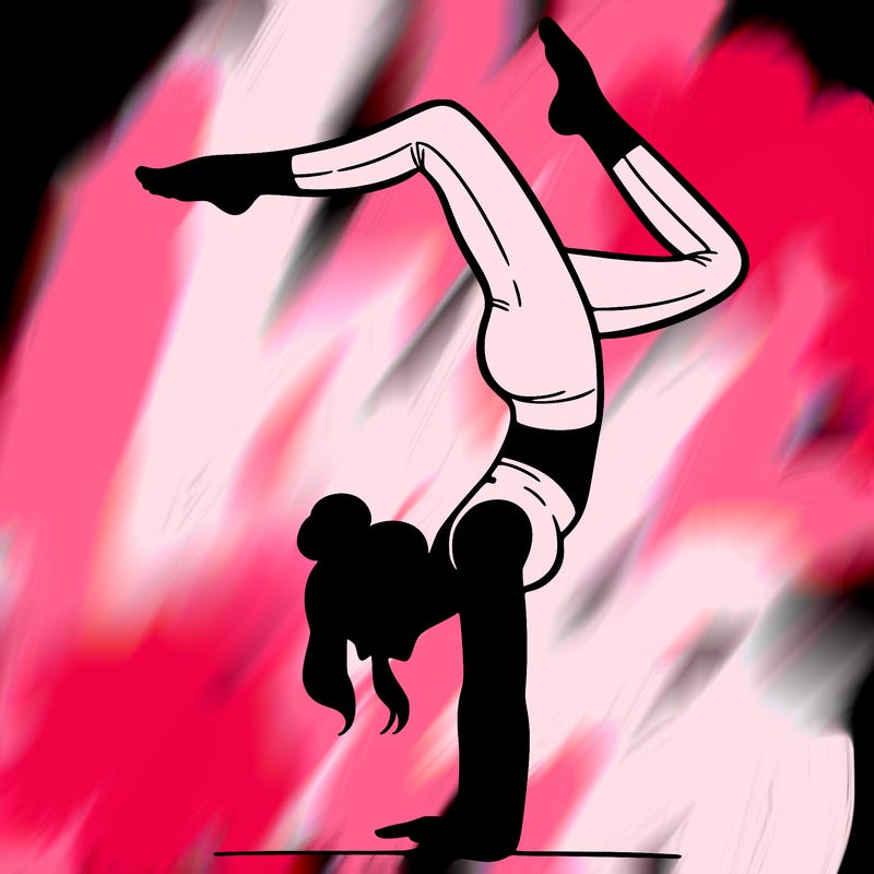 a woman doing a handstand