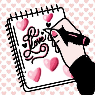 a hand writing “love” in calligraphy on a notebook