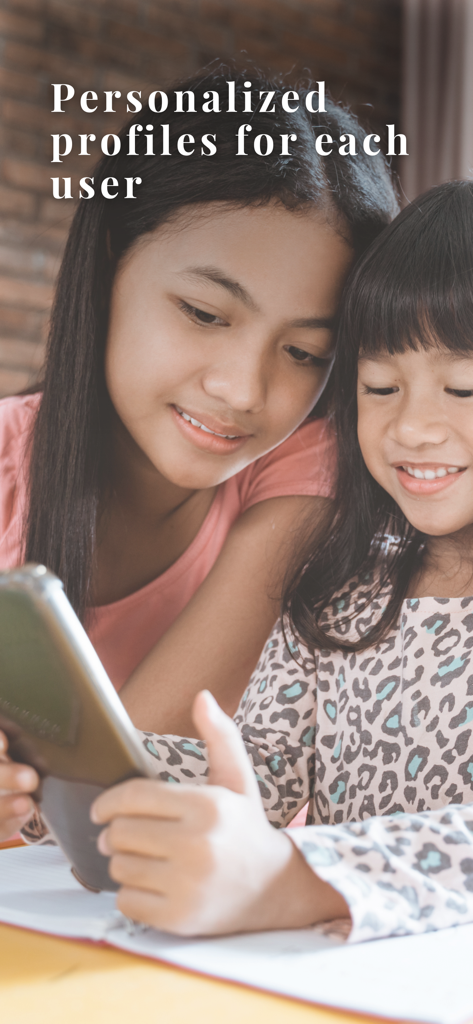 Two young girls looking at a smartphone with the text personalized profiles for each user
