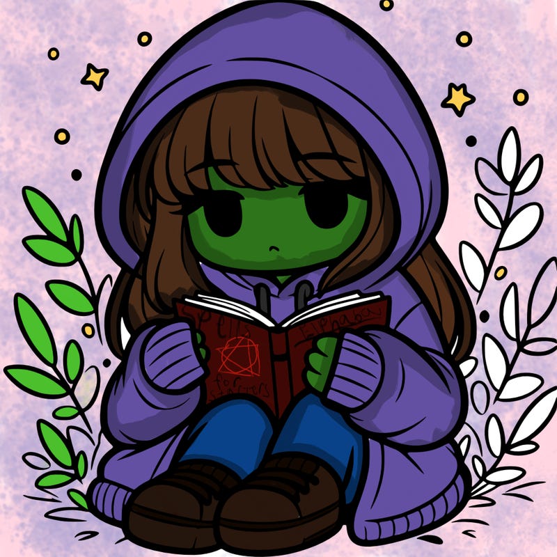 girl in oversized hoodie reading a book