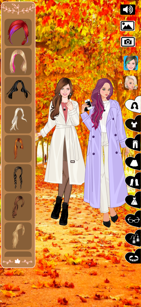 Autumn fashion dress up game - Dos chicas vestidas con abrigos largos de otoño en un parque con hojas otoñales naranjas.
