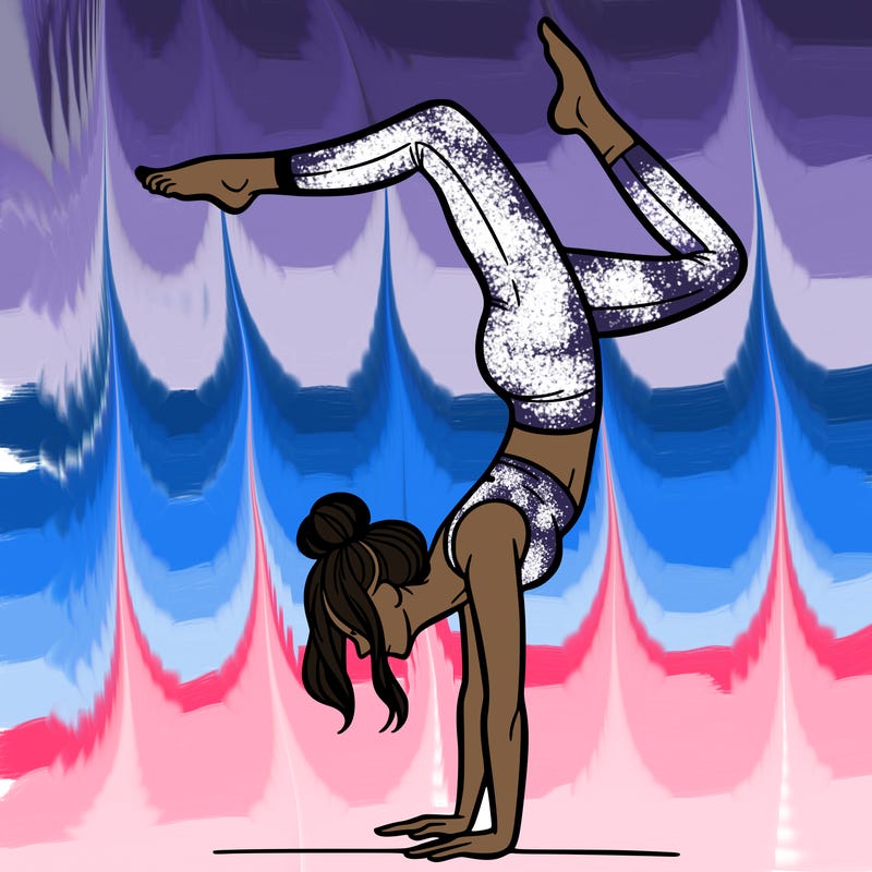 a woman doing a handstand