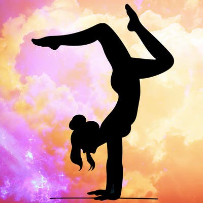 a woman doing a handstand