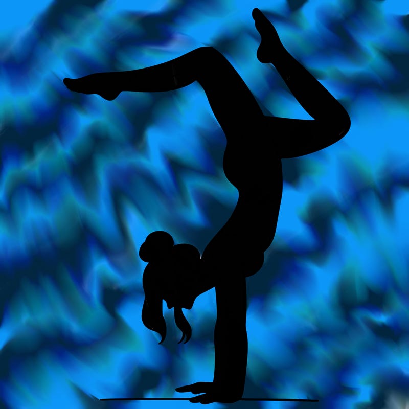 a woman doing a handstand