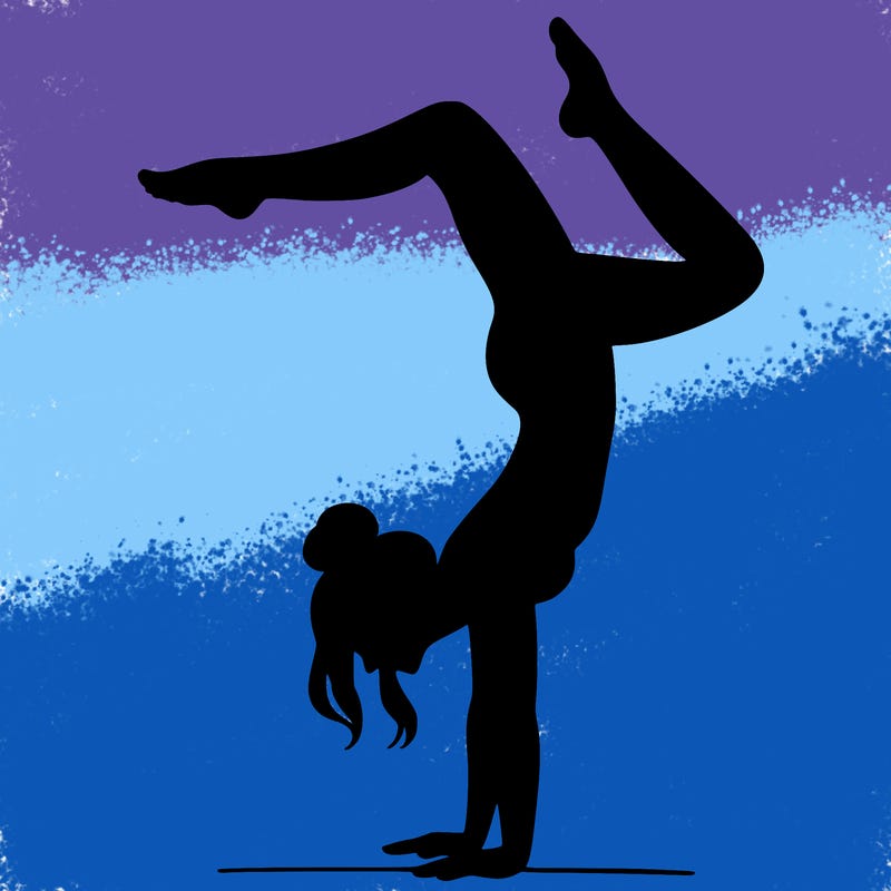 a woman doing a handstand