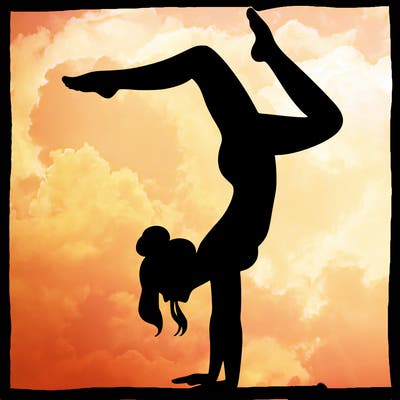 a woman doing a handstand