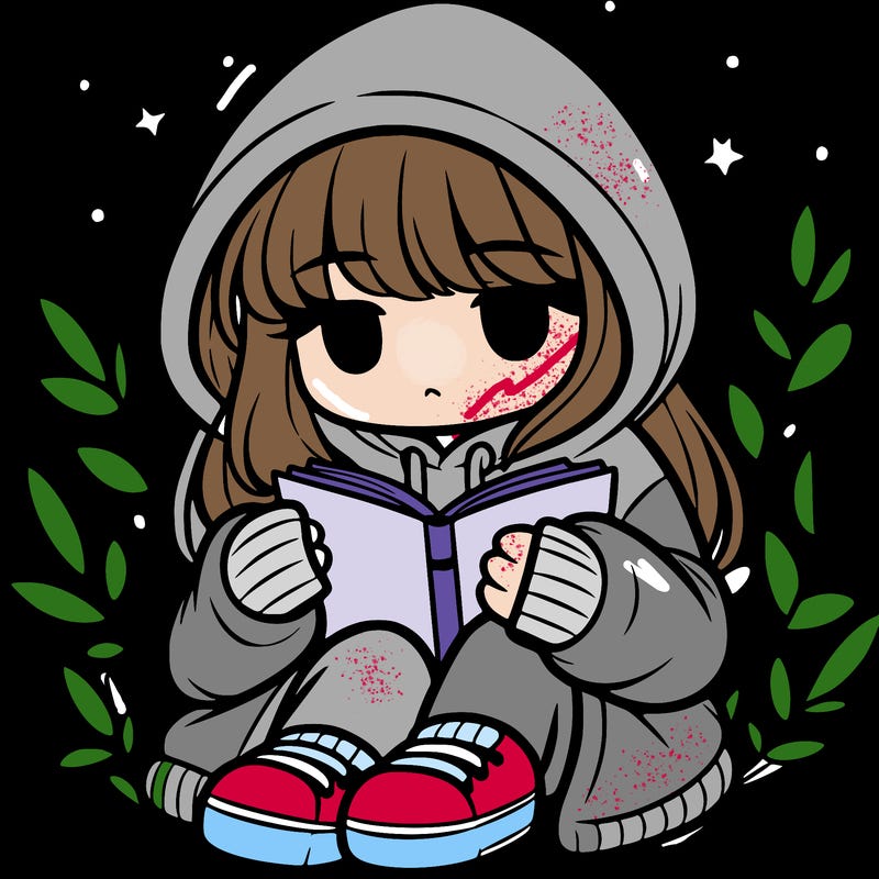 girl in oversized hoodie reading a book