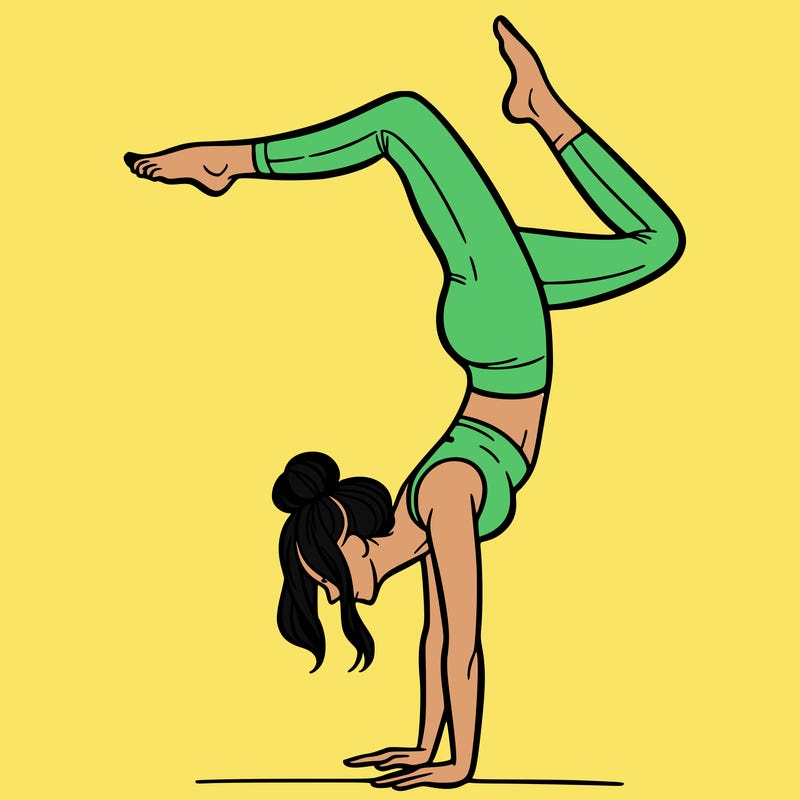 a woman doing a handstand