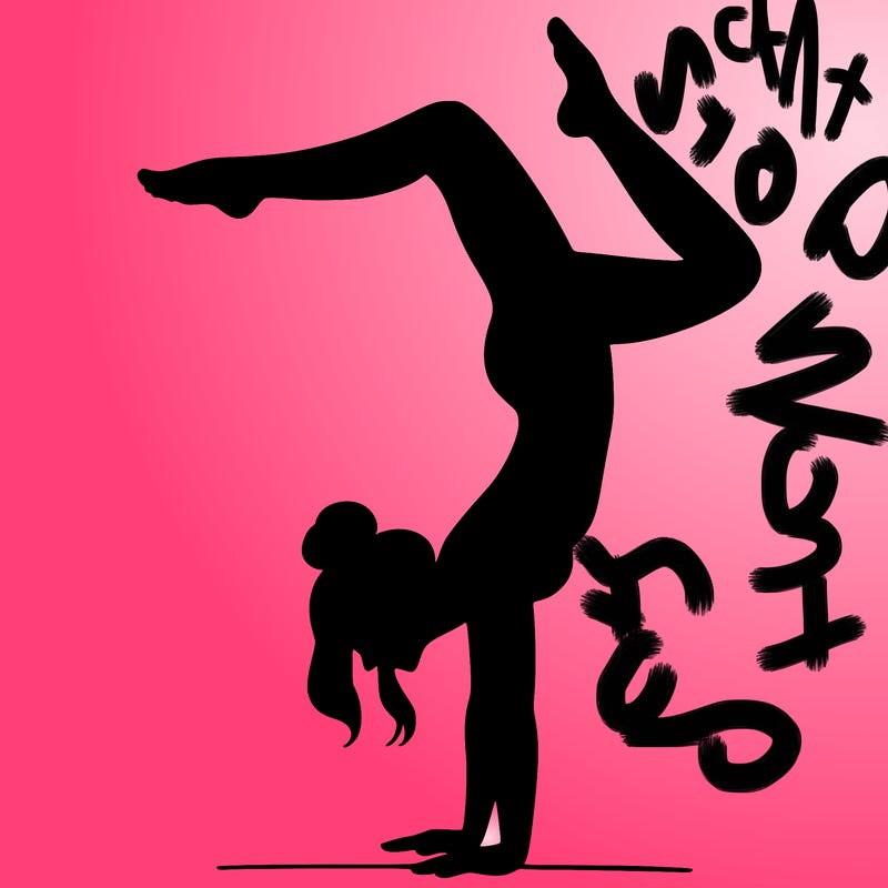 a woman doing a handstand