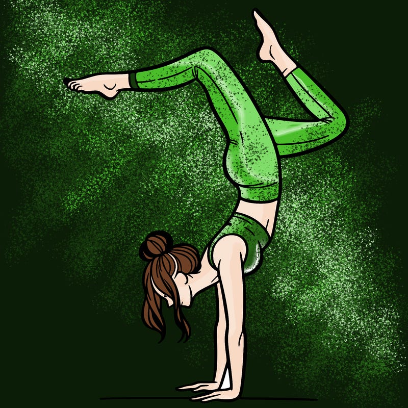 a woman doing a handstand