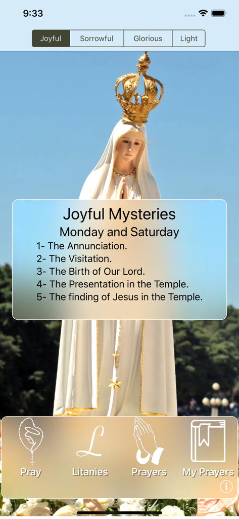 The Holy Rosary - Interface of The Holy Rosary app showing the Joyful Mysteries list over an image of the Virgin Mary.