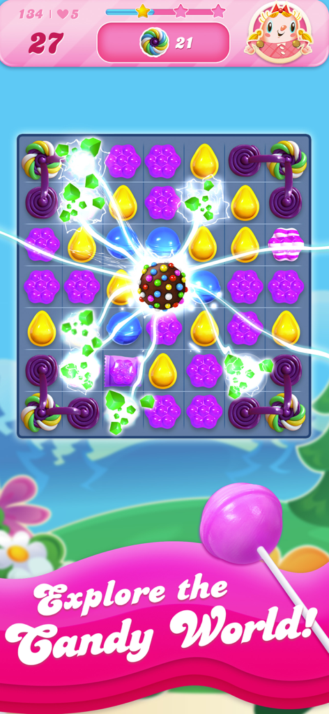 A color bomb candy explodes on a Candy Crush Saga puzzle board with bright electric effects.