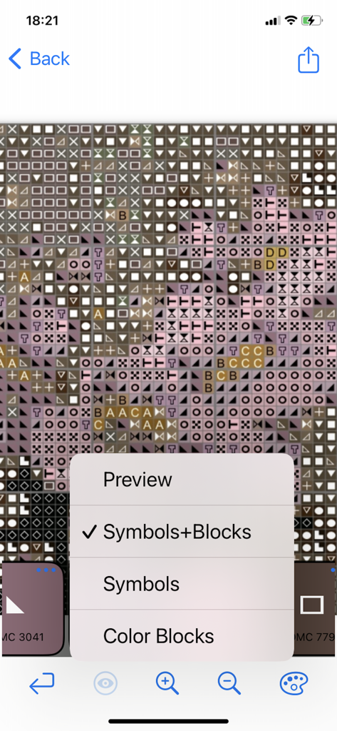 A cross-stitch pattern grid showing various symbols and color blocks with a menu for different view modes