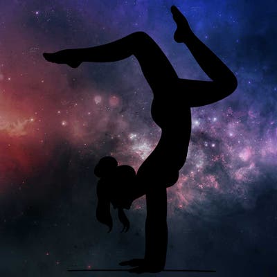 a woman doing a handstand