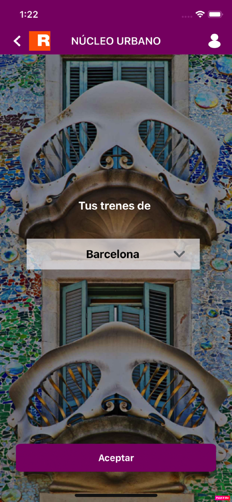 Interfaz de la aplicación Renfe Cercanias que muestra la selección de ciudades para Barcelona con un fondo de arquitectura de Gaudí.
