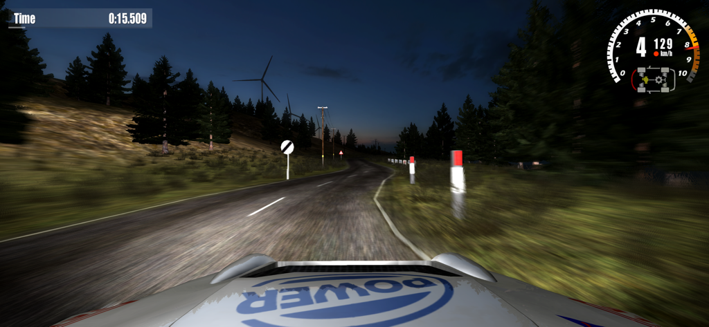First person hood view of a car racing on a dark tarmac road at night in Rush Rally 3