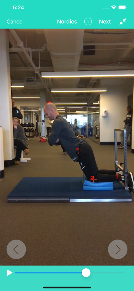 A man performing a Nordic hamstring exercise with digital tracking markers on his joints