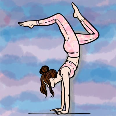 a woman doing a handstand