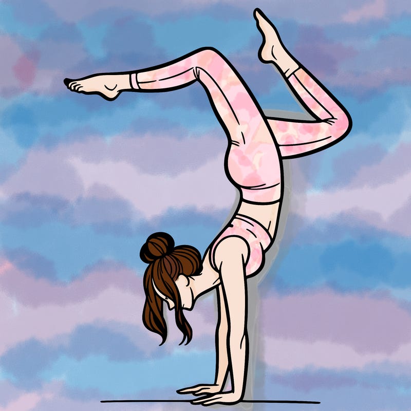 a woman doing a handstand