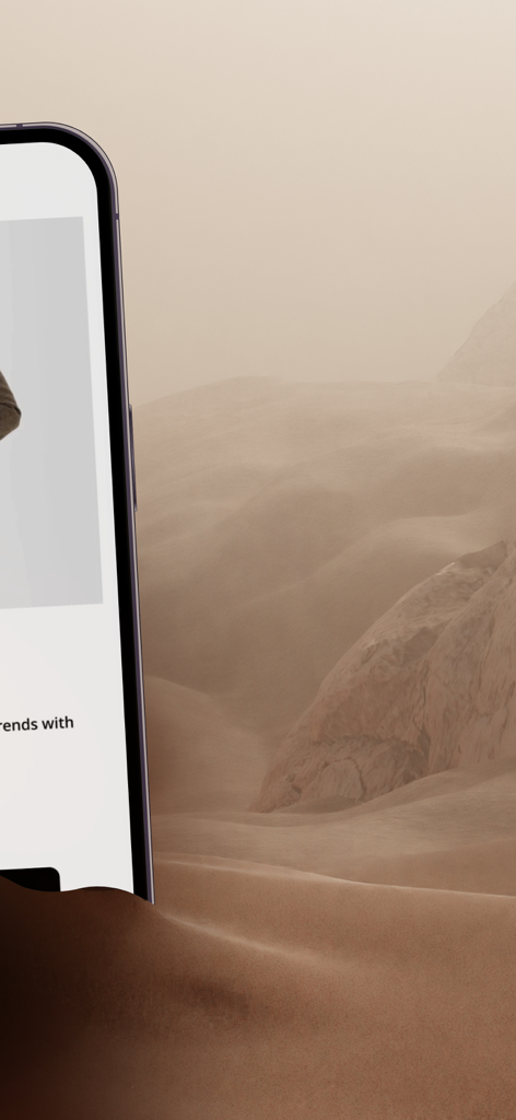 Naga Homme - A smartphone displaying the Naga Homme men's fashion shopping app against an atmospheric desert landscape background.