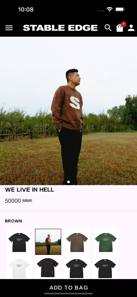 Product detail view in the Stable Edge shopping app showing a brown knit sweater and various color options for clothing