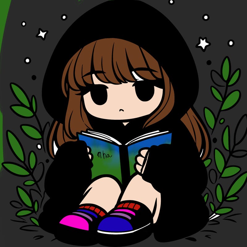 girl in oversized hoodie reading a book