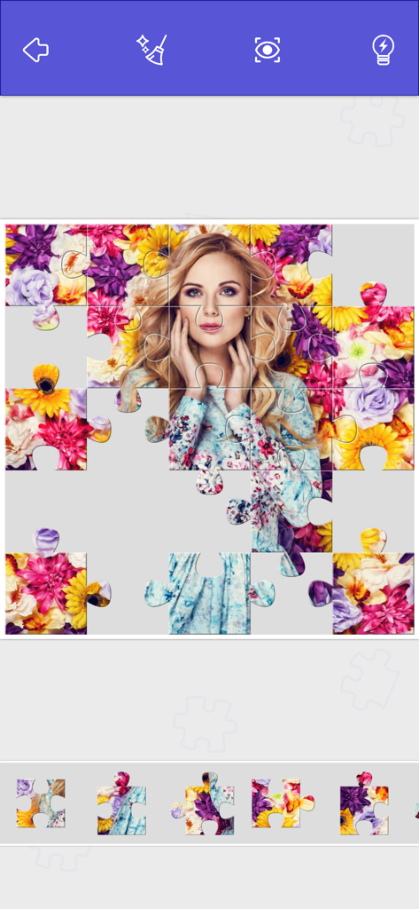 Captura de pantalla dentro del juego de un puzle deslizante digital que presenta a una mujer rodeada de flores coloridas en Puzzle World.