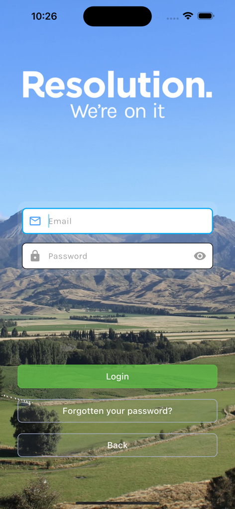 Resolution Farming App - Login screen of the Resolution Farming App displaying email and password fields over a scenic rural landscape background.