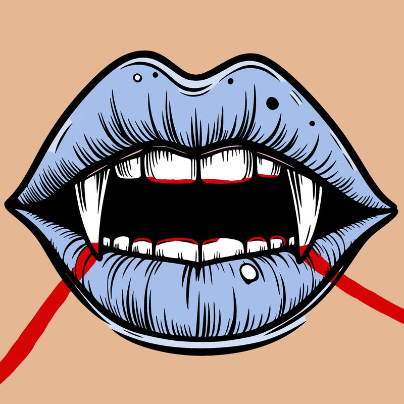 lips with vampire teeth