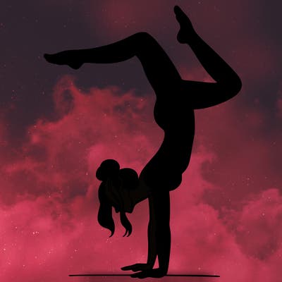 a woman doing a handstand