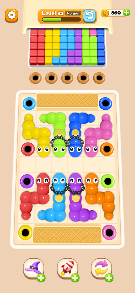 Worm Color Blast - Gameplay screen of Worm Color Blast showing colorful worms being sorted into matching holes.