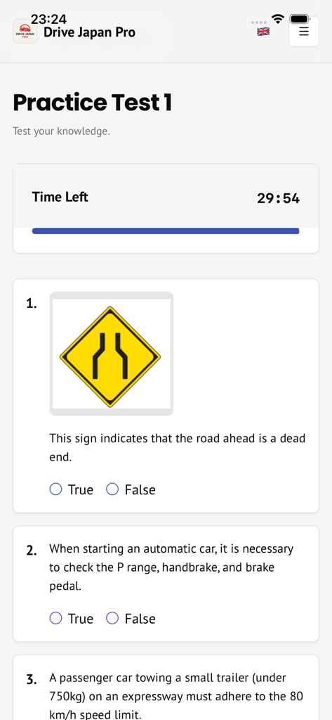 Drive Japan Pro - A practice test screen in the Drive Japan Pro app featuring a Japanese road sign quiz and multiple choice questions.