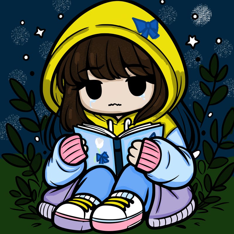 girl in oversized hoodie reading a book