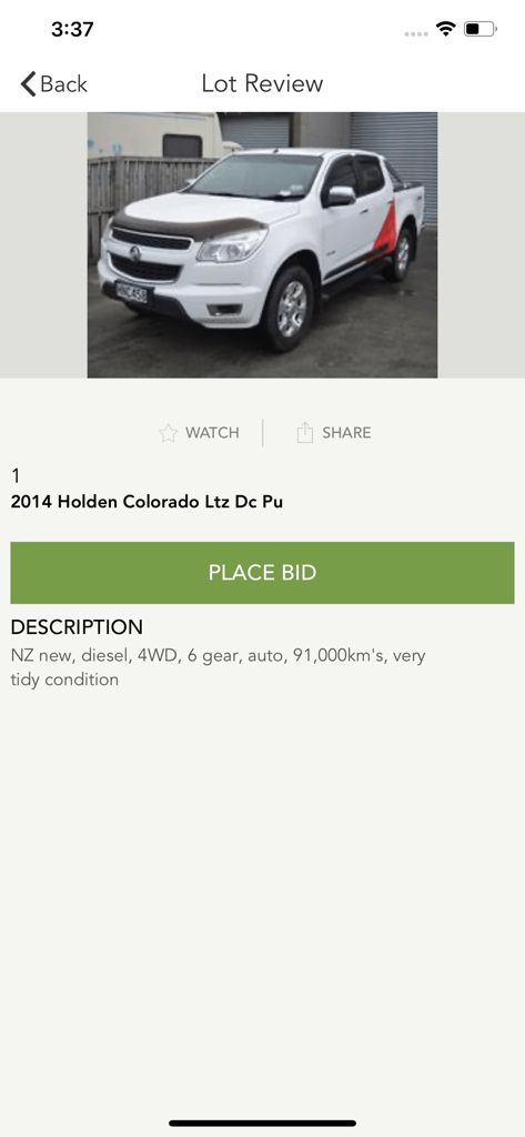 Mainland Auctions app screen showing a white 2014 Holden Colorado truck lot with a place bid button
