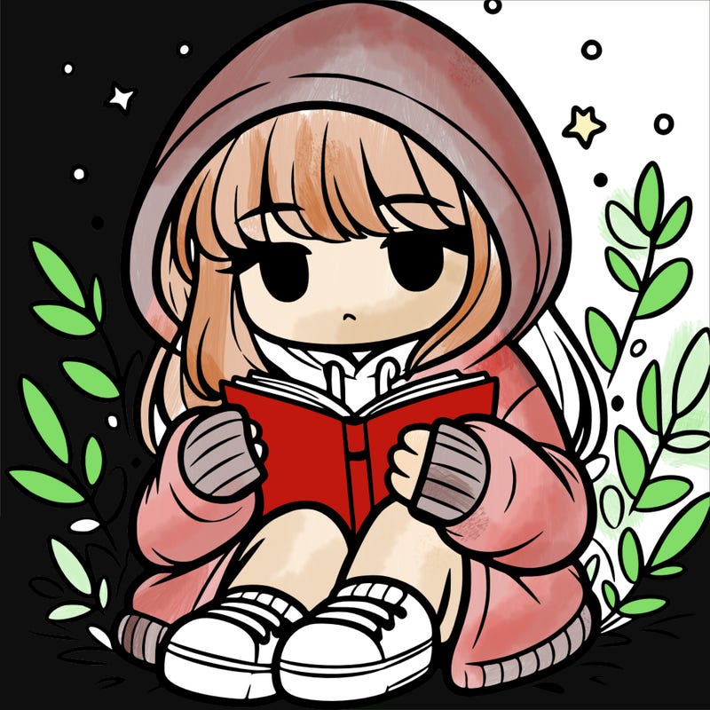 girl in oversized hoodie reading a book