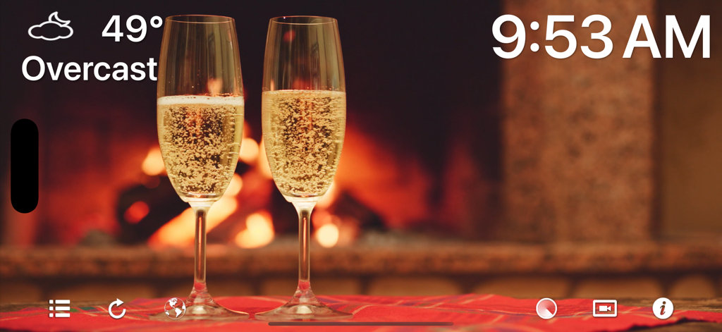 Fireplace 4K - Ultra HD Video - Two champagne glasses in front of a blurry fireplace background with weather and clock overlays