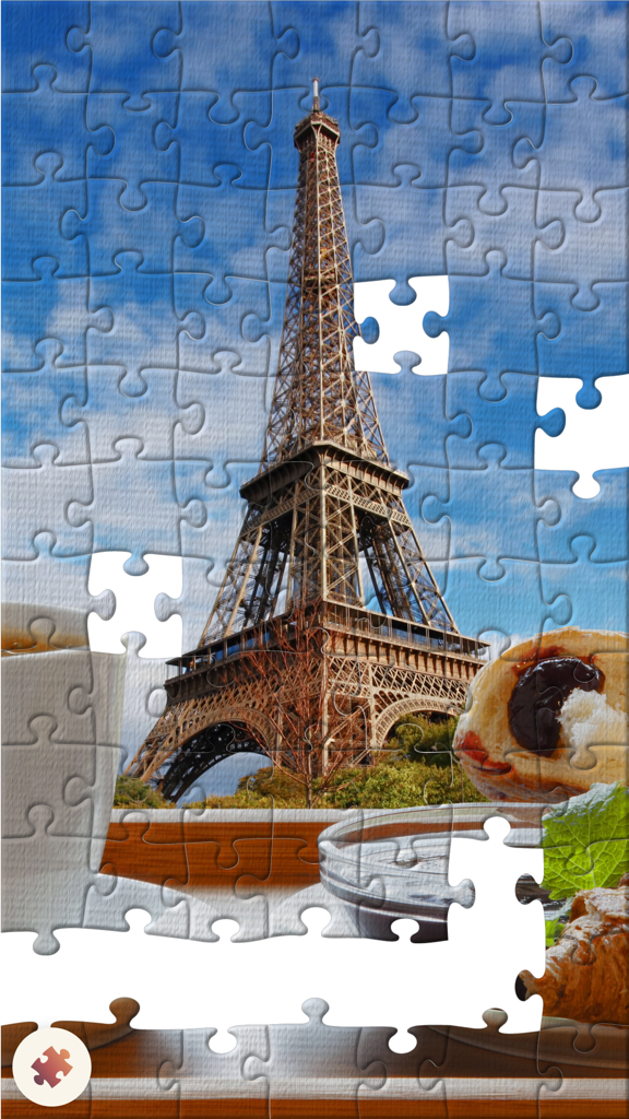 Puzzle.Plus – Classic jigsaw puzzle in your hands - A partially completed digital jigsaw puzzle of the Eiffel Tower in Paris.
