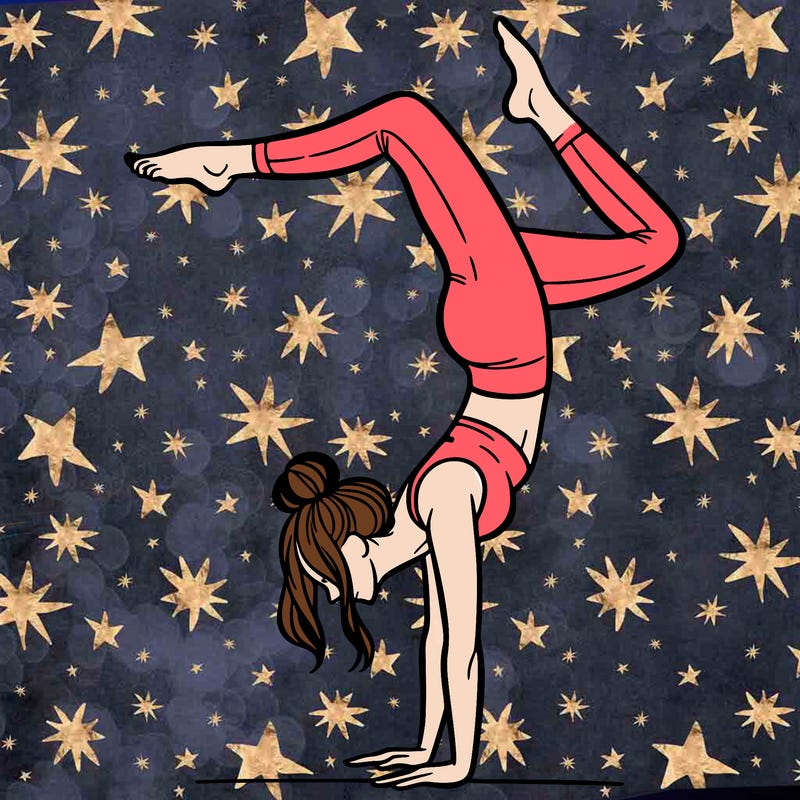 a woman doing a handstand